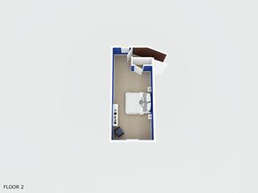Jacksonville house for rent - A room with a bed, desk, and chair.