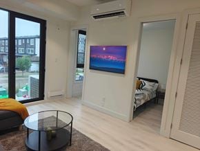 Winnipeg apartment for rent - A living room with a flat screen TV mounted on the wall.