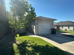 Grandview apartment for rent - A house with a tree in front of it.