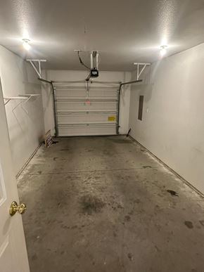 Grandview apartment for rent - A garage with a white door and a white wall.