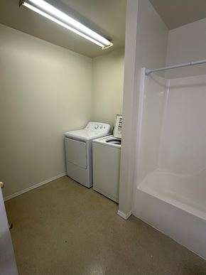 Grandview apartment for rent - A small white bathroom with a toilet and sink.