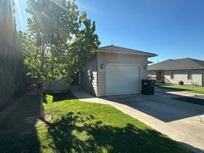 Grandview apartment for rent - A house with a tree in front of it.