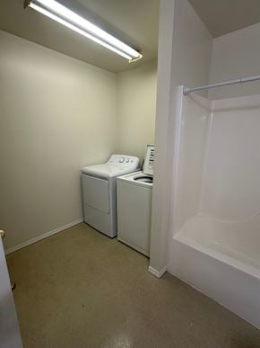 Grandview apartment for rent - A small white bathroom with a toilet and sink.