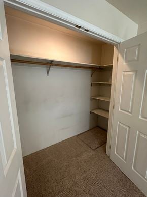 Grandview apartment for rent - A white door is open to a small closet with a shelving unit.