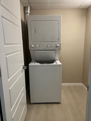 Edmonton house for rent - A white washing machine in a small room.