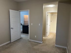 Edmonton house for rent - A room with a white door and carpeted floor.