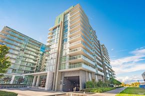 Richmond apartment for rent - A modern multi-story building with a mix of glass and stone facades.