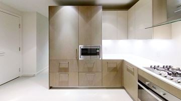 Richmond apartment for rent - A modern kitchen with a stove and oven built into the cabinetry.