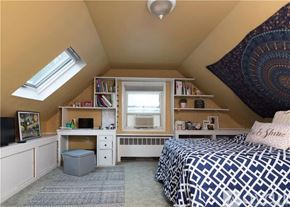 Fairfield house for rent - A bedroom with a bed, desk, and bookshelf.