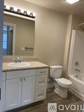 Missoula apartment for rent - A bathroom with a sink, toilet, and bathtub.
