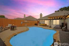 Waxahachie house for rent - A backyard with a pool and patio furniture.