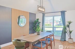 Waxahachie house for rent - A dining room with a wooden table and chairs.