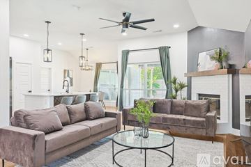 Waxahachie house for rent - A living room with a brown couch and a glass coffee table.