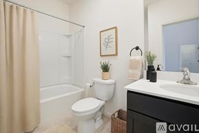 Eastampton Township apartment for rent - A large red brick building with a parking lot in front.