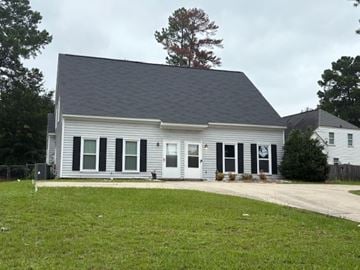 Columbia apartment for rent - A grey house with a black roof and white trim.