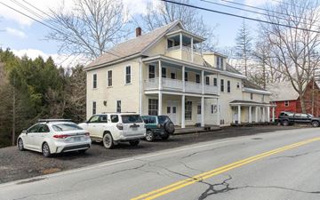 West Chesterfield apartment for rent - A white house with a car parked in front.