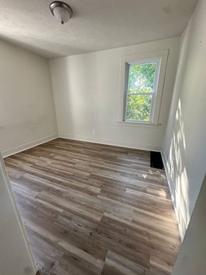 Lorain apartment for rent - A room with a window and wooden flooring.