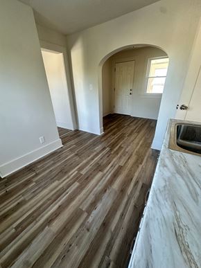 Lorain apartment for rent - A room with wooden flooring and a fireplace.