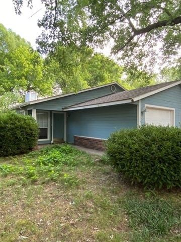 Fayetteville house for rent - A blue house with a white door and a window.