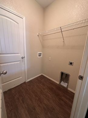 Centerton house for rent - A white door is on the left of a room with a shelf and a cat litter box.
