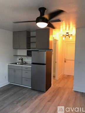 Naples apartment for rent - A kitchen with a fan and wooden floors.