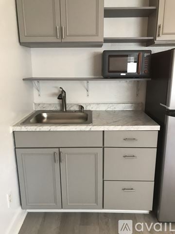 Naples apartment for rent - A kitchen with a sink and cabinets.