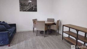 Miami apartment for rent - A living room with a couch, chair, and table.