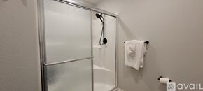 Joplin townhouse for rent - A white towel hangs on a towel rack in a bathroom.