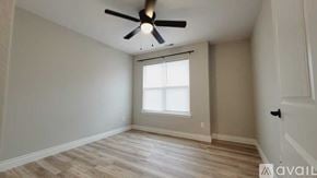 Joplin townhouse for rent - A kitchen with a black counter top and silver appliances.