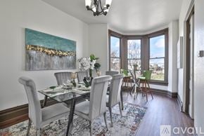 Oakland house for rent - A dining room with a glass table and chairs.