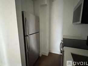 Cambridge apartment for rent - A kitchen with a refrigerator and a microwave.