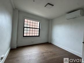 Cambridge apartment for rent - A room with a window and a ceiling fan.