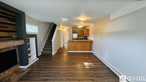 Spokane condo for rent - A house with a car parked in front of it.