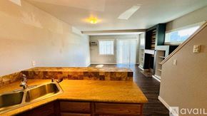 Spokane condo for rent - A spacious living room with a staircase leading to the upper floor.