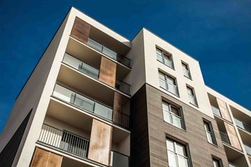 Portland apartment for rent - A modern building with balconies and windows.