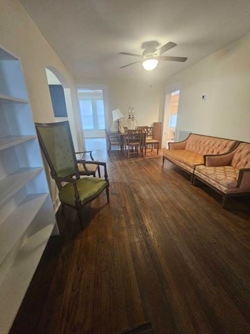 Pensacola house for rent - A living room with a brown couch and a green chair.