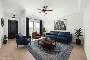 Greenville house for rent - A living room with a blue couch and a coffee table.