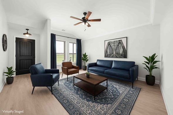 Greenville house for rent - A living room with a blue couch and a coffee table.