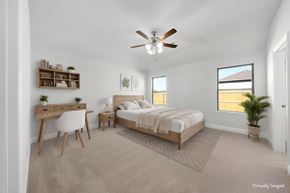 Greenville house for rent - A bedroom with a bed, desk, and chair.