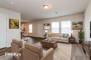 Conroe house for rent - A living room with a couch, chairs, and a coffee table.