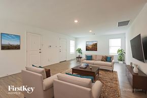 New Braunfels house for rent - A living room with a couch, chairs, and a rug.