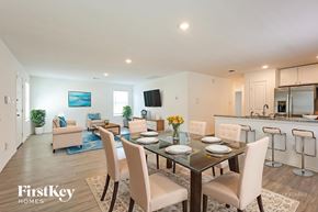 New Braunfels house for rent - A dining room with a glass table and chairs.