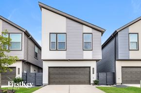 Shenandoah house for rent - A modern two-story house with a garage is showcased.