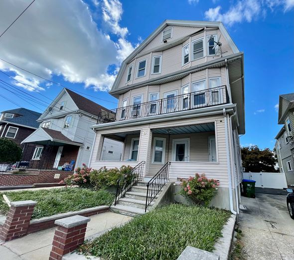 Medford apartment for rent - A two-story house with a balcony on the second floor.