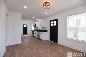 Berryville house for rent - A modern kitchen with white walls and wooden floors.