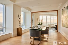 Boston apartment for rent - A modern dining room with a glass table and chairs.