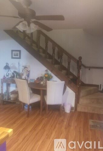 Bella Vista house for rent - A spacious room with a kitchen area and a sliding glass door leading outside.