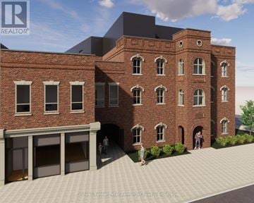 Arran-Elderslie townhouse for rent - A rendering of a red brick building with a black roof and a courtyard in front.