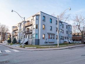 Toronto apartment for rent - Apartment building with a street view in front.