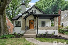 Cincinnati apartment for rent - A house with a brown door and a white front porch.